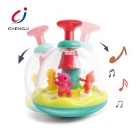 Wholesale battery operated plastic funny rolling toy baby rotating toys with sound